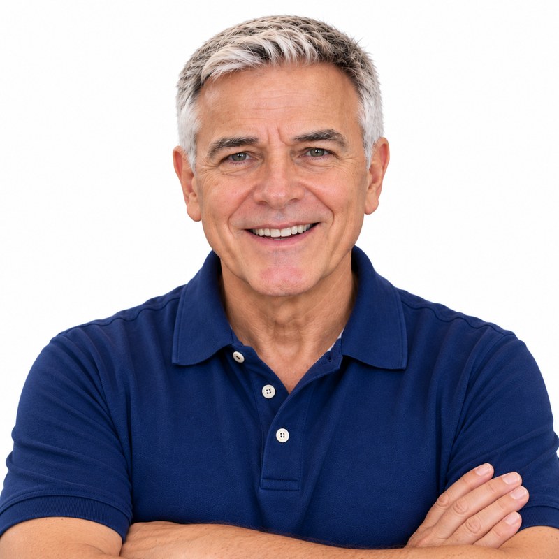 Graham, host of Graham's Senior Tricks, smiling with his arms crossed